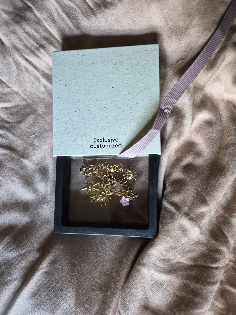 Gold Sun & Star Charm Bracelet with Pink Accent -